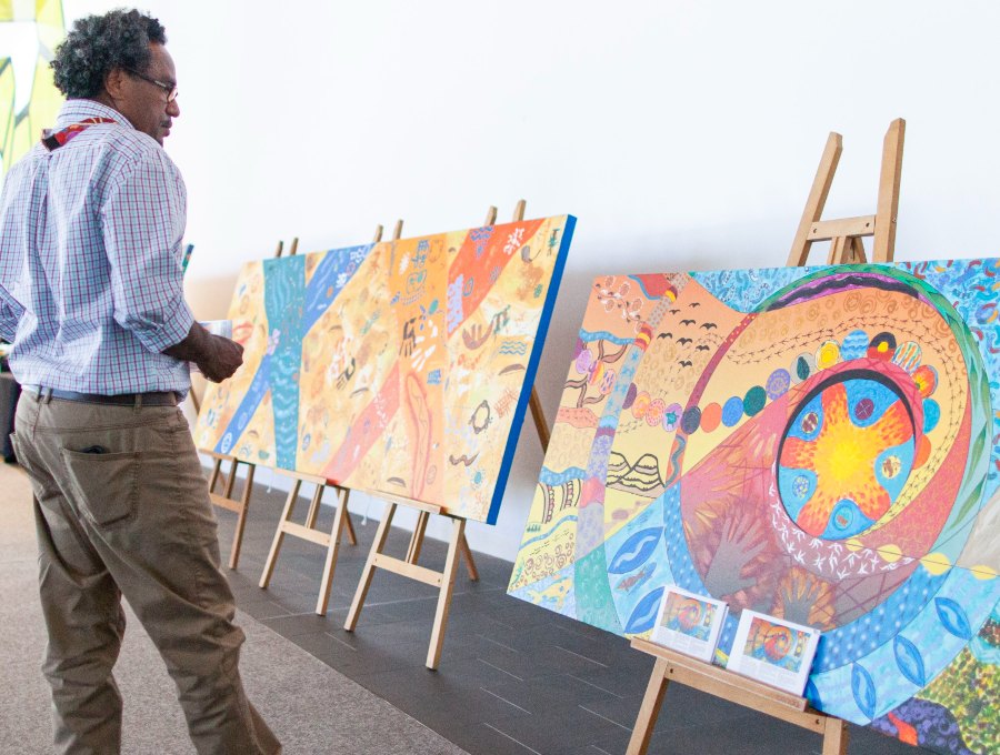 Attendant at RAP conference looks at artwork